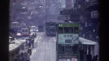 Hong Kong (1982): Busy City Scene With Two Level Tram Pulling Up To Stop And