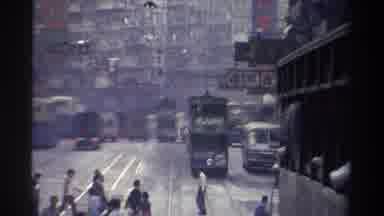 Hong Kong (1982): Hustle And Bustle Of City Streets With Buses Cars And People In