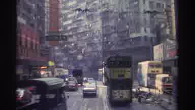 Hong Kong (1982): Passing Pair Of Double Decker Buses On Busy City Street