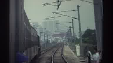 Hong Kong (1982): Passengers View While Riding On A Train As It Comes Into The