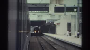 Hong Kong (1982): Metropolitan Mass Transportation Trains Passing At A Platform