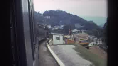 Hong Kong (1982): Train Is Moving Slowly Through A Village Where Some People