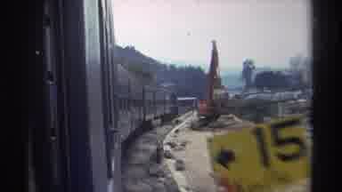 Hong Kong (1982): Train Passing A Sign A Still Crane With Houses And Buildings On