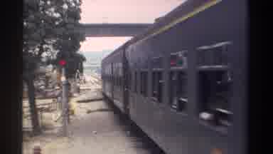 Taiwan (1982): Train Moving Across Railroad Tracks And Small Crowd Walking By