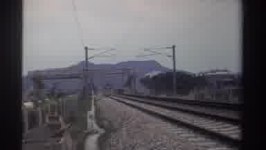 TAIWAN-1982: Grey Train Traveling On Tracks On A Cloudy Day
