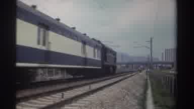 Taiwan (1982): Blue And White Train Running Through City