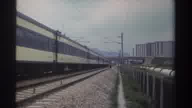 Taiwan (1982): Long Train Passing A Man Standing On Rocks Next To The Train Tracks
