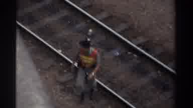Taiwan (1982): Working Man Walking Over Railroad Tracks As He Is Distracted