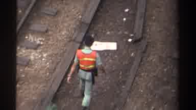 Taiwan (1982): Person Wearing Orange Safety Vest And Uniform Walking Along Train