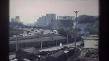Taiwan (1982): Transportation In A Busy City Featuring Traffic On A Road And A