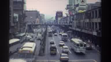 Taiwan (1982): Bustling Traffic Flows On A Busy Two Way Road In A City Motorcycles