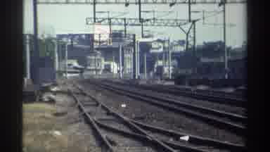 Taiwan (1982): Old Locomotive Train Traveling Down Train Tracks To Train Station