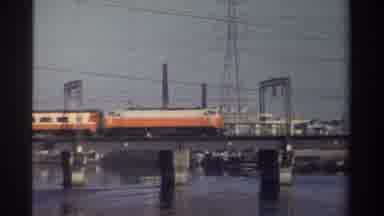 Taiwan (1982): Orange And White Train Going Right Across Bridge That Sits Over