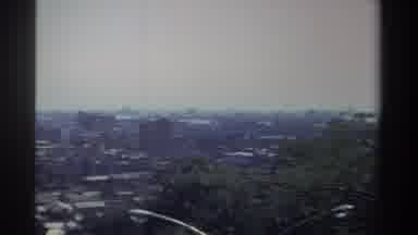 Taiwan (1982): Panning Camera Shot Of A City From Atop A Forested Hill During