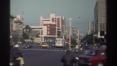 Taiwan (1982): Busy Cityscape With Automobiles Bikes And Scooters On A Clear Day