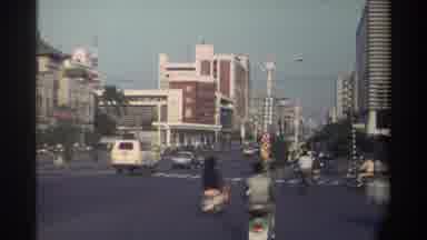 Taiwan (1982): Busy Foreign City Heavy Vehicle And Scooter Traffic Going In Every