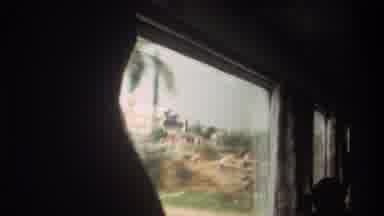 Taiwan (1982): View Out Of Train Window Including Passing Buildings Train Tracks