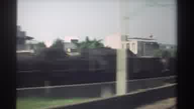 Taiwan (1982): Train Ride Through The City Shows Other Stopped Trains Buildings