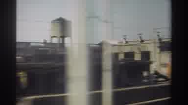 Taiwan (1982): Train Rolling Past A Water Tower Other Trains Buildings And Houses