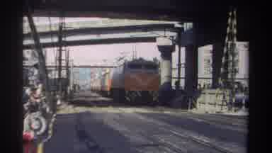 Taiwan (1982): Orange And White Passenger Train Soaring Past Onlookers From A Safe
