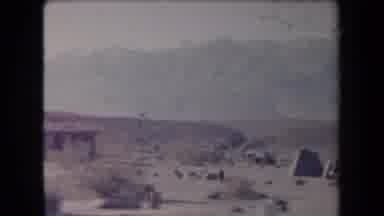 Arizona USA (1958): Near A Small House And Other Buildings In A Barren Landscape