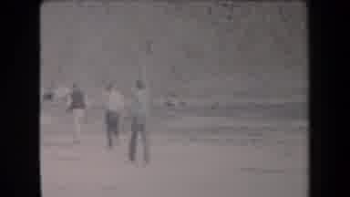 Arizona USA-1958: Group Of Young Males Walk Along The Sandy Desert