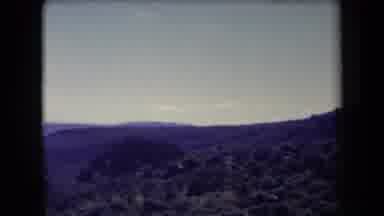 Arizona USA (1958): Camera Pans Left Looking At Distant Hills Trees And Mountains
