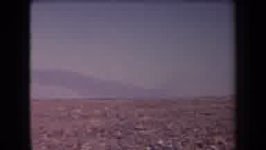 Arizona USA (1958): Panoramic Desert With Mountains In Background And A Few Small