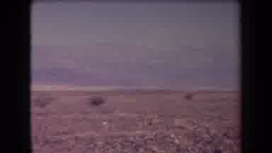 Arizona USA (1958): Passing Through A Desert With Little Vegetation With Thin And