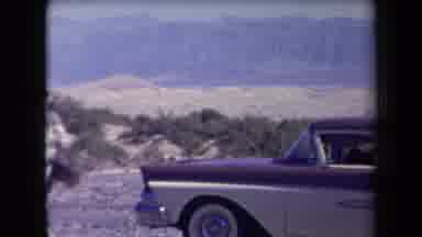 Arizona USA (1958): Blue Car Standing By The Sea Near The Sand Then Shows Many