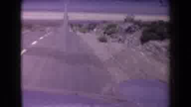 Arizona USA (1958): Car Driving Fast Down Long Deserted Two Lane Highway Through