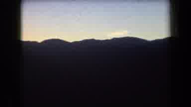 Arizona USA (1958): Camera Panning Across Dark Mountainous Horizon Below A Dark