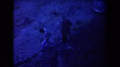 Arizona USA (1958): Two People Walking Down A Rocky Mountain Side At Dusk