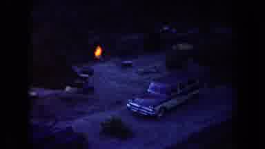 Arizona USA (1958): Camping With A Small Fire Next To A Parked Station Wagon At