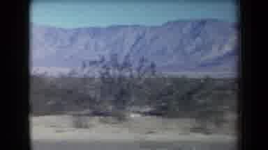 Arizona USA (1958): Man In Cowboy Hat And Plaid Shirt Walking In Desert Mountains