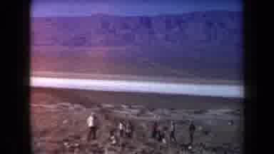 Arizona USA (1958): People Working In A Field With Mountains In The Background