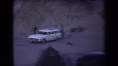 Arizona USA (1958): An Aerial One White Car Parked In A Desert On A Dune
