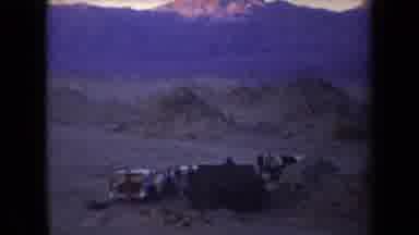 Arizona USA (1958): Mountains And People Camping On Beach At Dusk