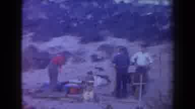 Arizona USA (1958): Men Hanging Out On Mountain Side Eating And Enjoying Nearby