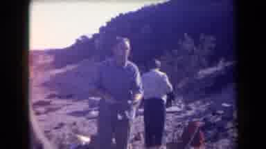 Arizona USA (1958): People Walking Up A Hill Looking Like They Are Setting Up For