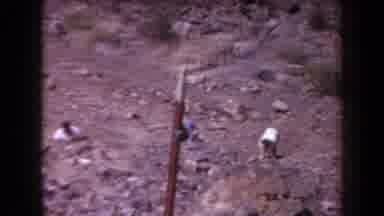Arizona USA (1958): Dark Skinned People Bent Over In A Row Working In A Rock