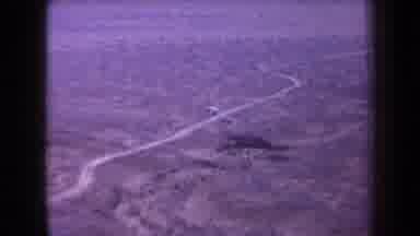 Arizona USA (1958): Dry And Flat Winding Road Going Across A Desert With Sparse