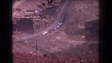 Arizona USA (1958): Caravan Of Three Vehicles Two People Walking Uphill On Sunny