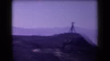 Arizona USA (1958): Passing Hilltop Object And Mountains On Sunny Day
