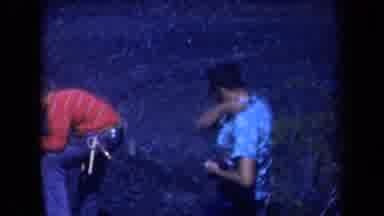 Arizona USA (1958): Two Men In Graphic Print Shirts On Rocky Terrain In Windy