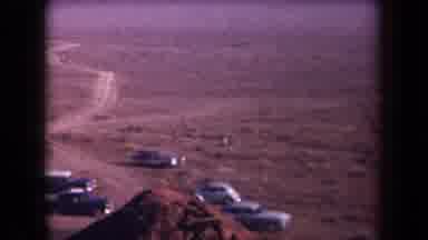 Arizona USA (1958): Many Cars Parked On Side Of Dirt Road In Brown Dry Desert