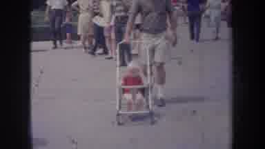 Michigan USA-1968: Baby Sitting In Stroller At Public Event