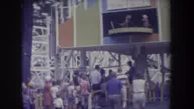 Michigan USA (1968): An Amusement Park Filled With People Walking Around And Some
