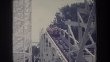 Michigan USA (1968): A Big Amusement Park With People In The Cars And Railroad