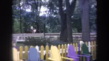 Michigan USA (1968): People Riding Horses And Walking Past Yellow Picket Fence On